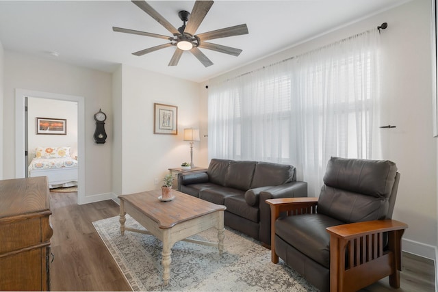 1236 Monterra Way, Fate, TX 75087 - living room featuring a ceiling fan, wood finished floors, and baseboards
