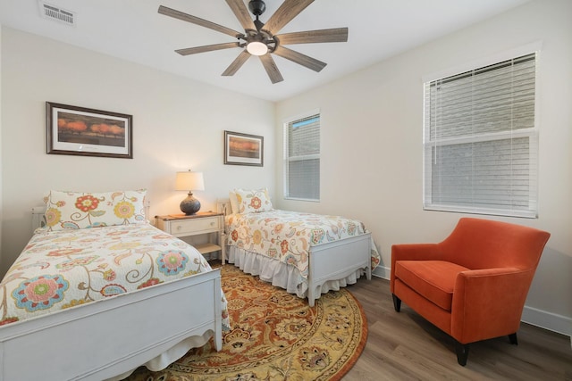 1236 Monterra Way, Fate, TX 75087 - bedroom featuring wood finished floors, a ceiling fan, and baseboards