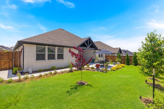 1236 Monterra Way, Fate, TX 75087 - back of house featuring a patio, roof with shingles, brick siding, and a gate