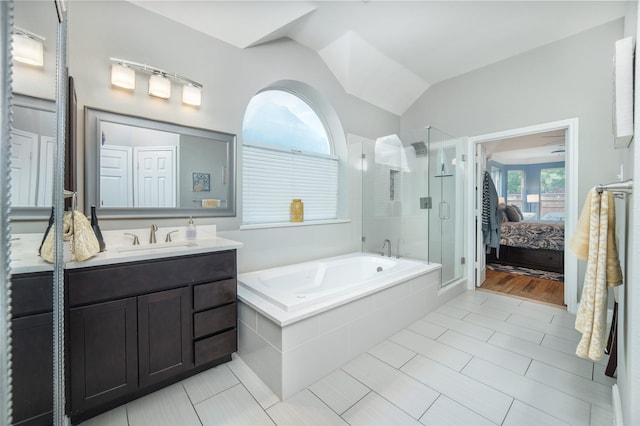 7612 Trevino Dr, Plano, TX 75025 - ensuite bathroom with a stall shower, a garden tub, vanity, lofted ceiling, and tile patterned flooring