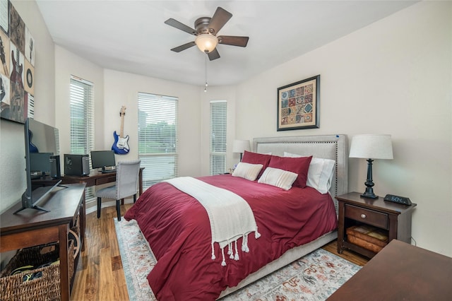 7612 Trevino Dr, Plano, TX 75025 - bedroom featuring wood finished floors, an office area, and ceiling fan