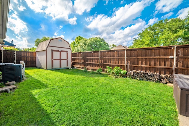 7612 Trevino Dr, Plano, TX 75025 - view of yard featuring a storage unit and an outdoor structure