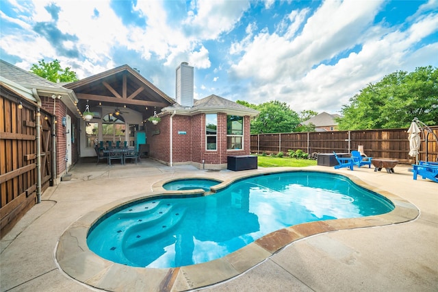 7612 Trevino Dr, Plano, TX 75025 - view of swimming pool with a patio, a fire pit, ceiling fan, a fenced backyard, and a pool with connected hot tub