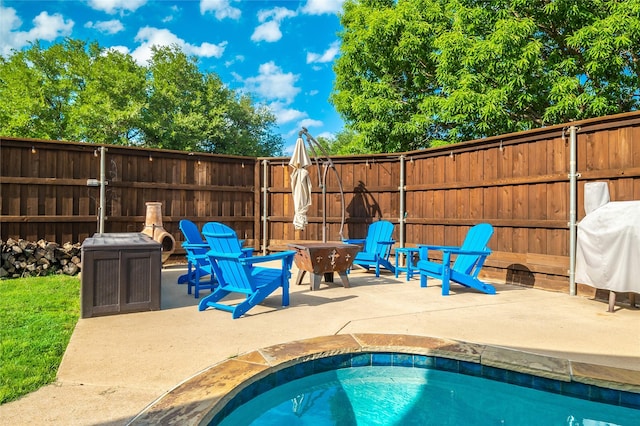 7612 Trevino Dr, Plano, TX 75025 - view of pool featuring a fire pit, a patio, and fence