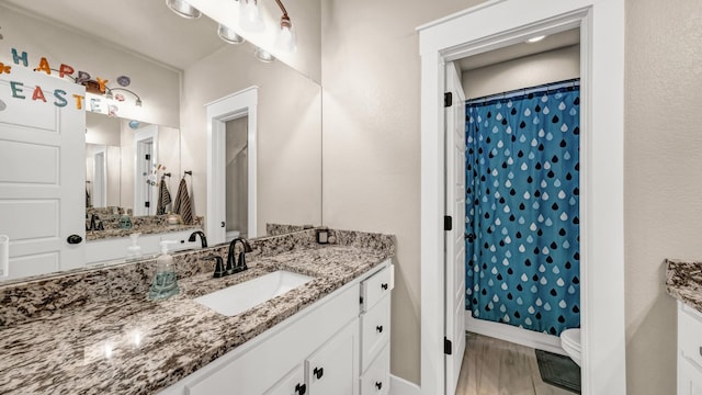 201 Dover Ct, Weatherford, TX 76087 - full bathroom with toilet, vanity, a shower with shower curtain, and baseboards