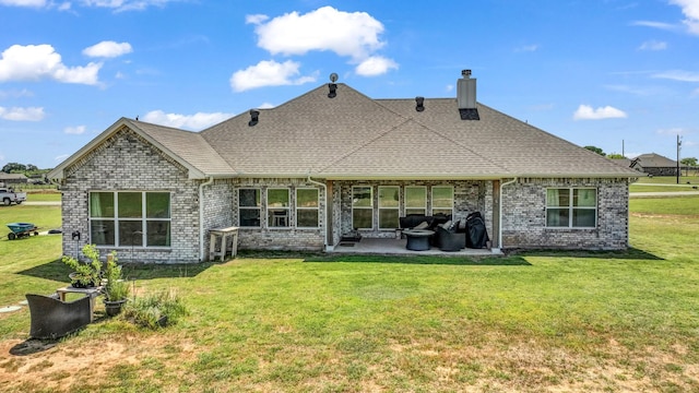 201 Dover Ct, Weatherford, TX 76087 - back of property with a patio area, a chimney, a shingled roof, a yard, and brick siding
