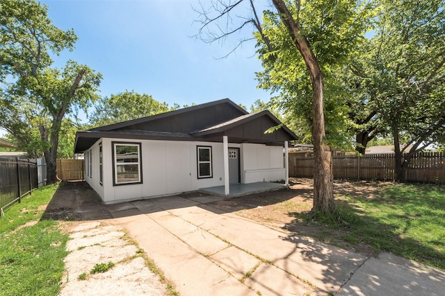 1005 Osborne Ln, Fort Worth, TX 76112 - back of house featuring a patio area and a fenced backyard
