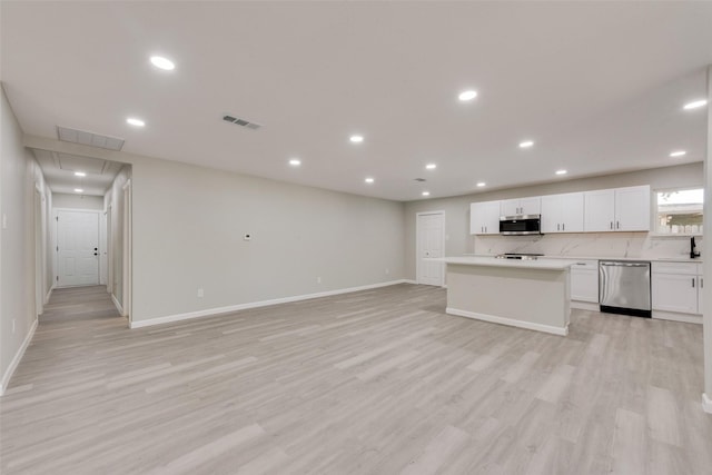 1005 Osborne Ln, Fort Worth, TX 76112 - kitchen with stainless steel appliances, visible vents, and recessed lighting