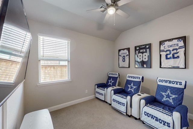 sitting room featuring lofted ceiling, baseboards, carpet, and ceiling fan