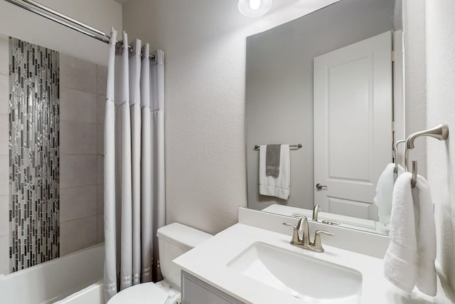 full bath featuring a textured wall, vanity, shower / bathtub combination with curtain, and toilet