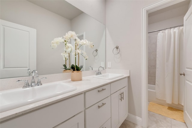 full bathroom with shower / tub combo with curtain, a sink, and double vanity