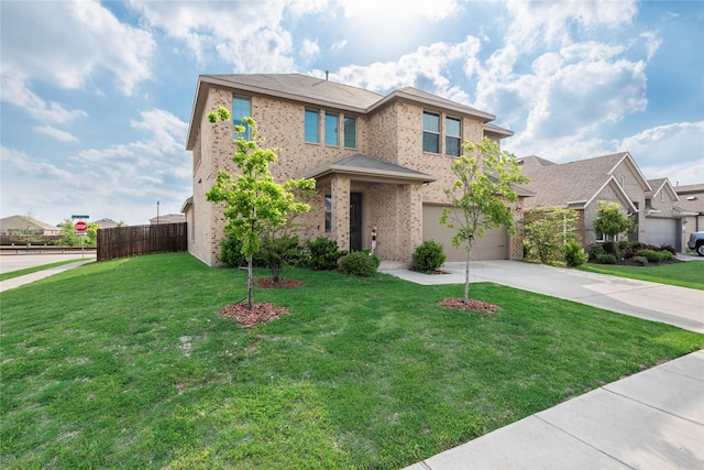 traditional home featuring fence, driveway, brick siding, a front yard, and a garage