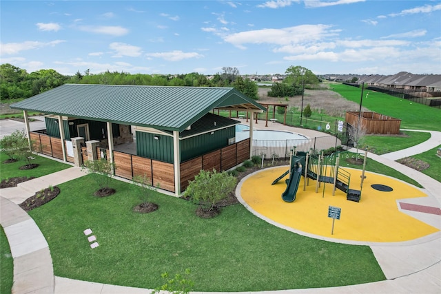 exterior space featuring an exterior structure and a playground