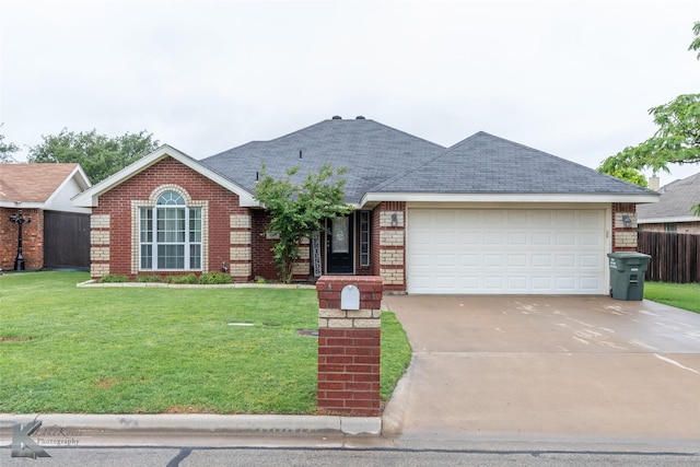 4910 Coyote Run, Abilene, TX 79602 - ranch-style home featuring concrete driveway, an attached garage, and brick siding