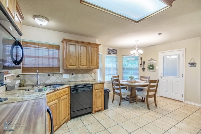 4910 Coyote Run, Abilene, TX 79602 - kitchen featuring black dishwasher, a sink, tasteful backsplash, a chandelier, and light tile patterned floors