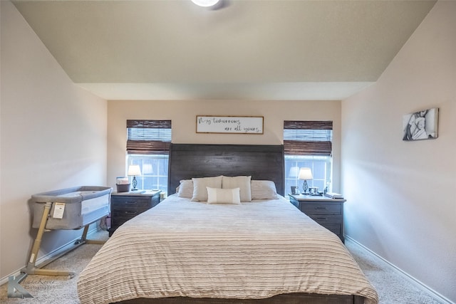 4910 Coyote Run, Abilene, TX 79602 - carpeted bedroom with baseboards and multiple windows