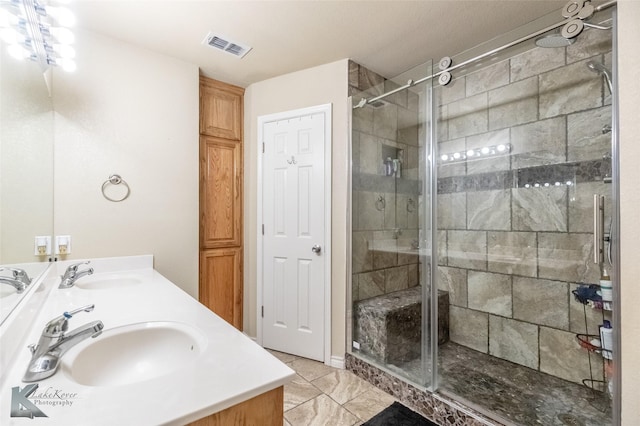 4910 Coyote Run, Abilene, TX 79602 - full bath with a stall shower, double vanity, and tile patterned floors