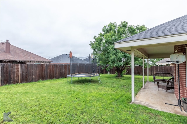 4910 Coyote Run, Abilene, TX 79602 - view of yard featuring a trampoline and a patio area