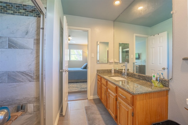 full bathroom with tile patterned floors, connected bathroom, vanity, baseboards, and recessed lighting