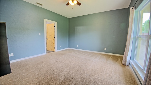 209 E Meadows St, Saint Jo, TX 76265 - carpeted spare room featuring a ceiling fan and baseboards