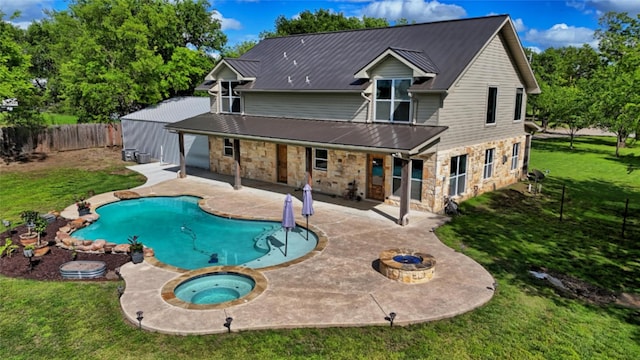 209 E Meadows St, Saint Jo, TX 76265 - rear view of property with stone siding, an in-ground hot tub, a patio, metal roof, and view of scattered trees