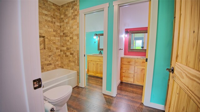 full bath featuring vanity, toilet, and wood finished floors