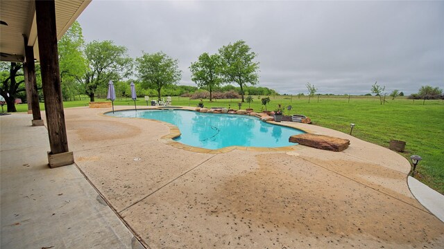 view of swimming pool featuring a fenced in pool and a patio