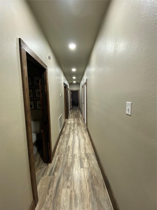 1609 Beech St, Cisco, TX 76437 - hall featuring light wood finished floors, recessed lighting, and baseboards
