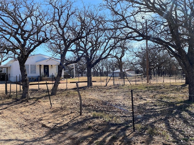 1609 Beech St, Cisco, TX 76437 - fenced front yard featuring a playground