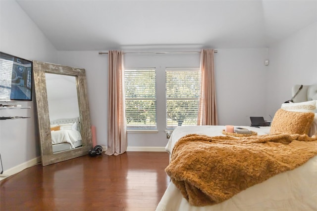 2409 Eisenhower Dr, Mckinney, TX 75071 - bedroom featuring baseboards, vaulted ceiling, and wood finished floors