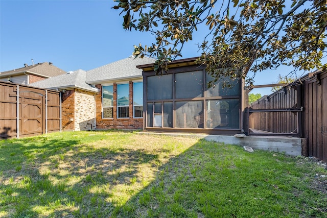10401 Max Ln, Frisco, TX 75035 - back of property with brick siding, a gate, a fenced backyard, and a shingled roof