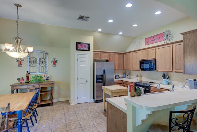 kitchen with recessed lighting, light countertops, visible vents, black appliances, and a peninsula