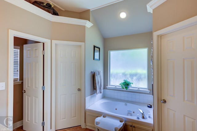 full bathroom featuring lofted ceiling and a tub with jets