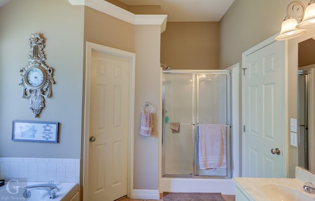 full bathroom with a garden tub, vanity, and a stall shower