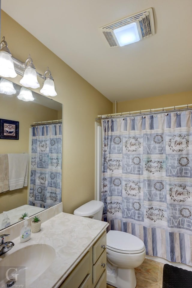 full bathroom with visible vents, vanity, and toilet