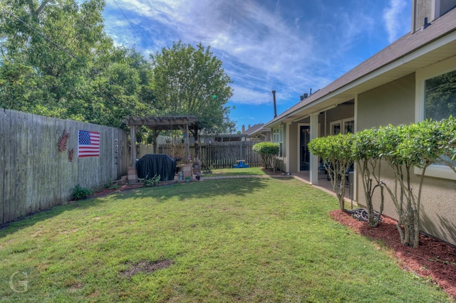 view of yard featuring a fenced backyard and a pergola