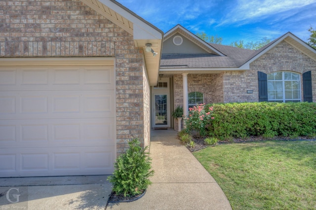 ranch-style house featuring a front lawn, concrete driveway, brick siding, roof with shingles, and a garage