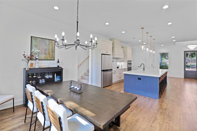 8919 Southern Shore Ct, Kemp, TX 75143 - dining area featuring a chandelier, light wood-type flooring, baseboards, and recessed lighting