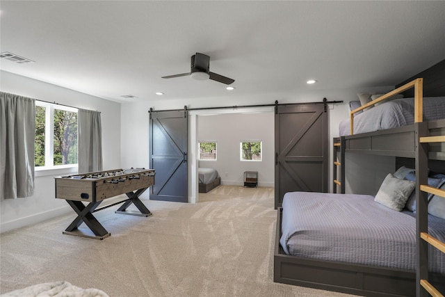 8919 Southern Shore Ct, Kemp, TX 75143 - bedroom featuring light carpet, visible vents, recessed lighting, and a barn door