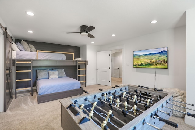 8919 Southern Shore Ct, Kemp, TX 75143 - carpeted bedroom featuring recessed lighting, a barn door, and a ceiling fan