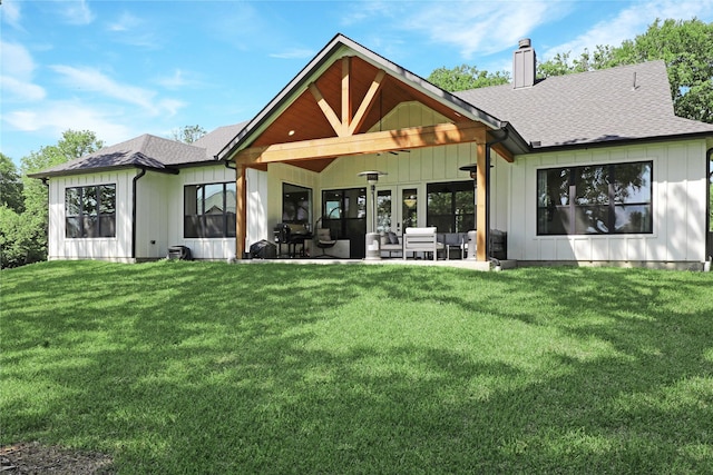 8919 Southern Shore Ct, Kemp, TX 75143 - rear view of house with a lawn, roof with shingles, a chimney, and board and batten siding