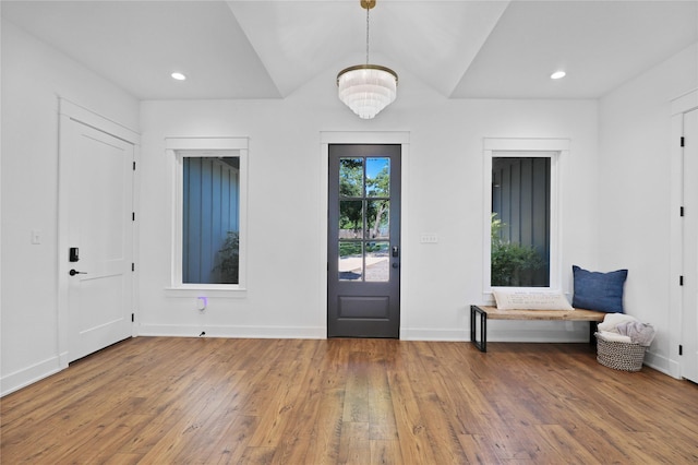 8919 Southern Shore Ct, Kemp, TX 75143 - foyer entrance featuring baseboards, wood finished floors, an inviting chandelier, and recessed lighting