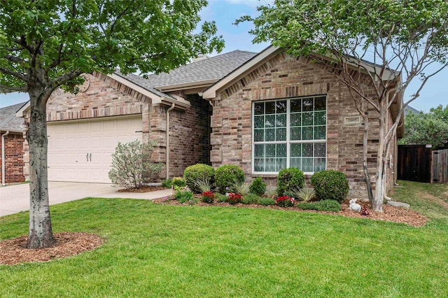 ranch-style house with brick siding, an attached garage, fence, and a front lawn