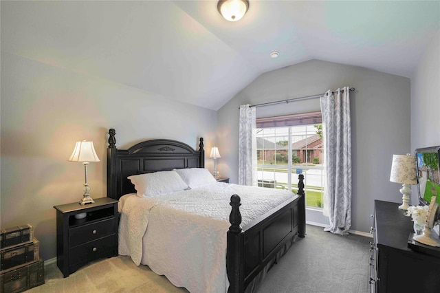 bedroom with baseboards, carpet flooring, and vaulted ceiling