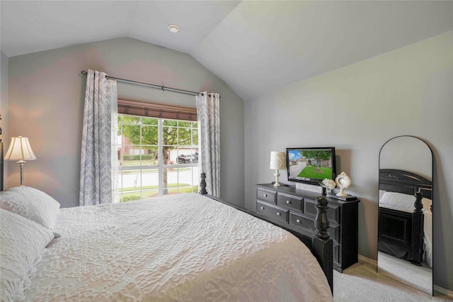 bedroom featuring carpet floors and vaulted ceiling