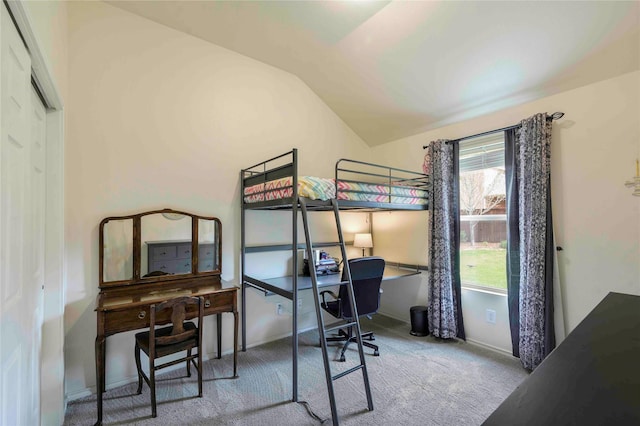 bedroom featuring carpet floors, baseboards, and lofted ceiling