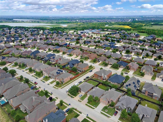 bird's eye view featuring a water view and a residential view