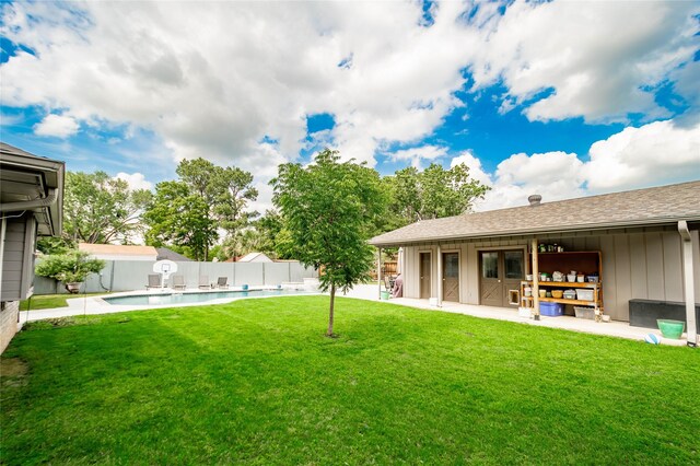 view of yard featuring a fenced in pool, a patio, and a fenced backyard