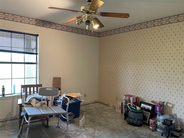 dining space with a ceiling fan and concrete floors