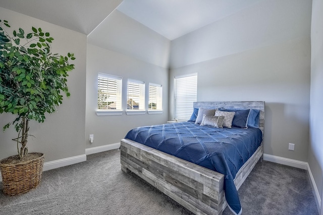 bedroom with baseboards, multiple windows, and carpet